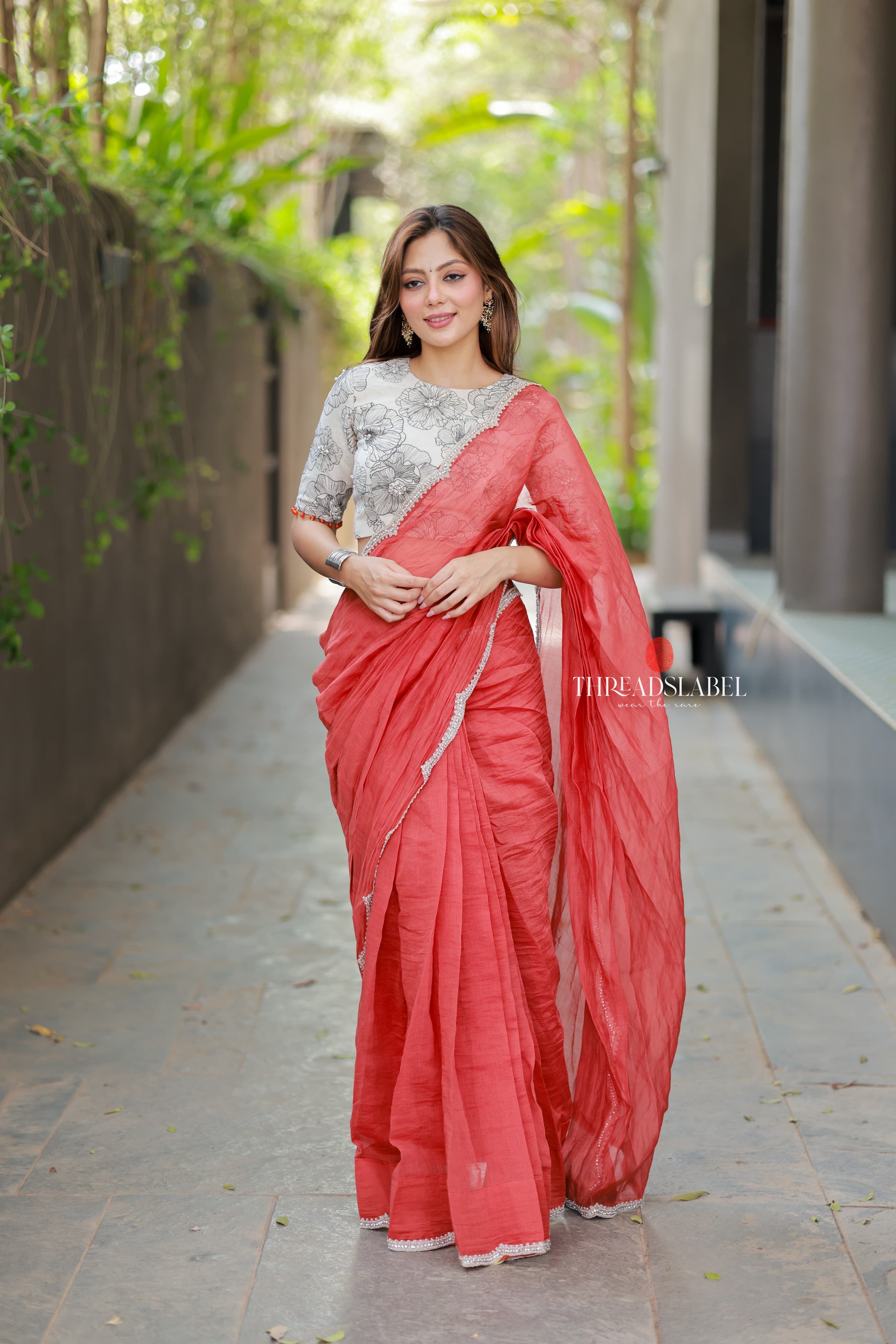 Orange rust saree with pearl work blouse