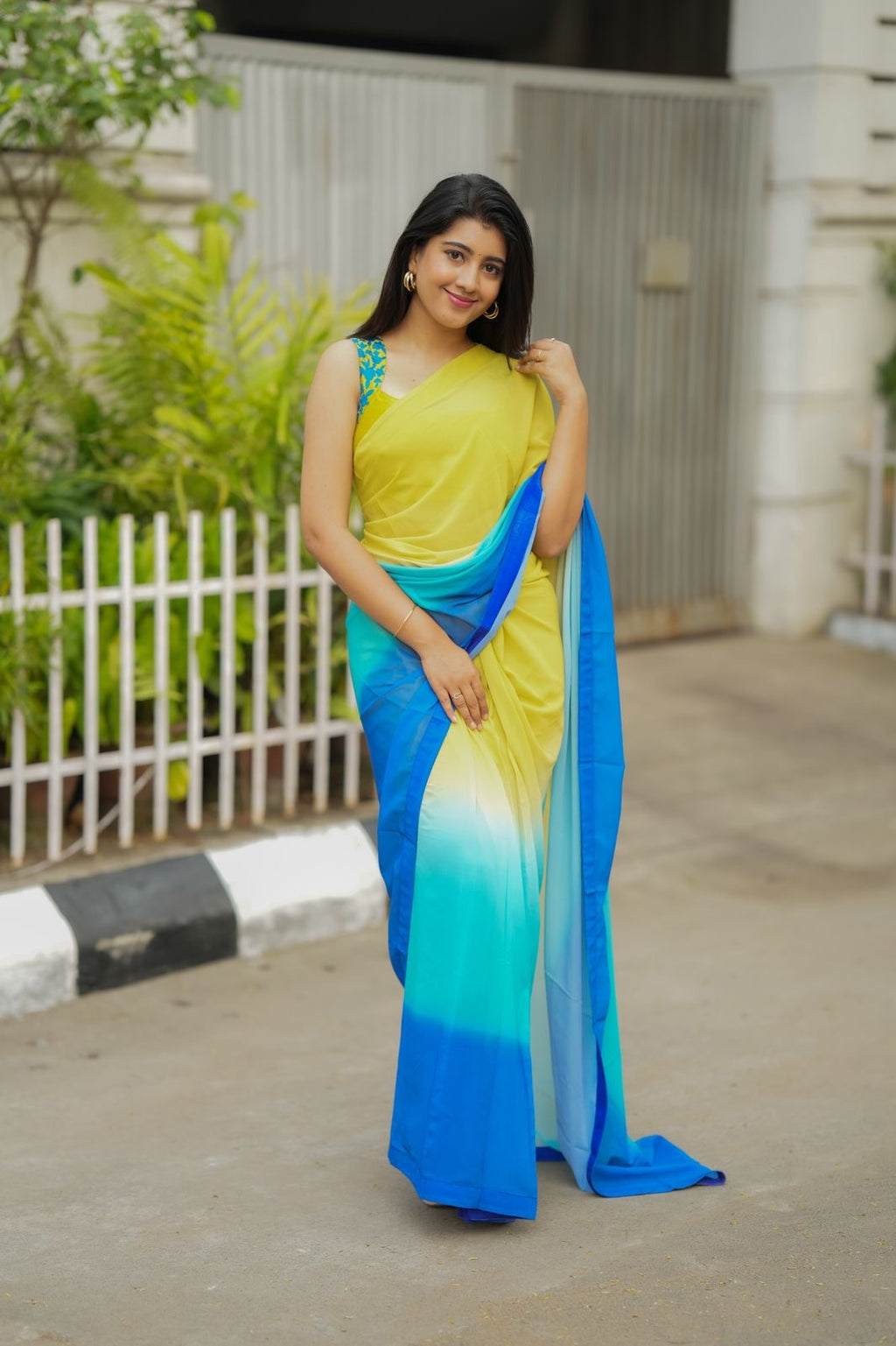 Multi georgette saree with yellow hand made blouse