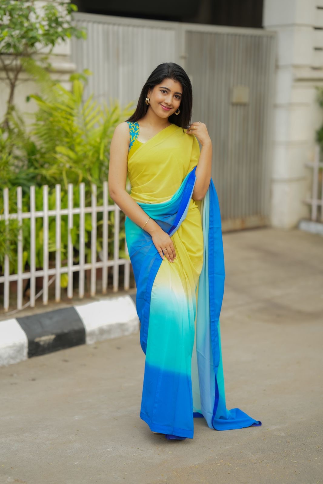 Multi georgette saree with yellow hand made blouse