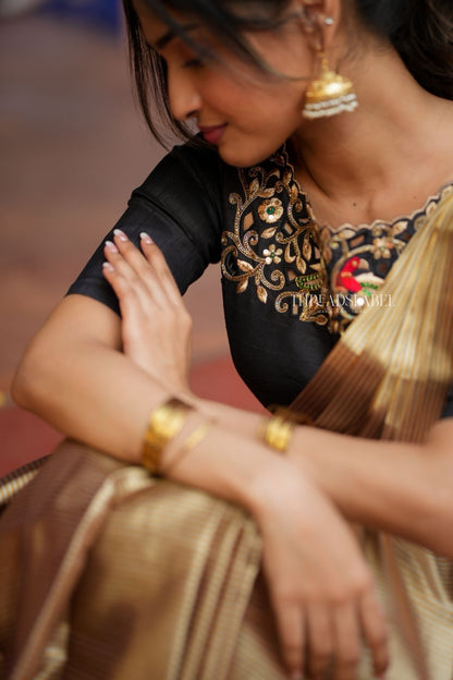 Golden tissue saree with black hand work blouse