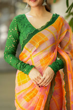Orange viscose jute saree with green hakoba blouse