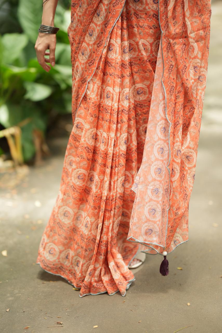 Pastel peach chiffon saree with brown hand work blouse