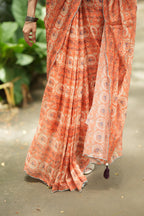 Pastel peach chiffon saree with brown hand work blouse