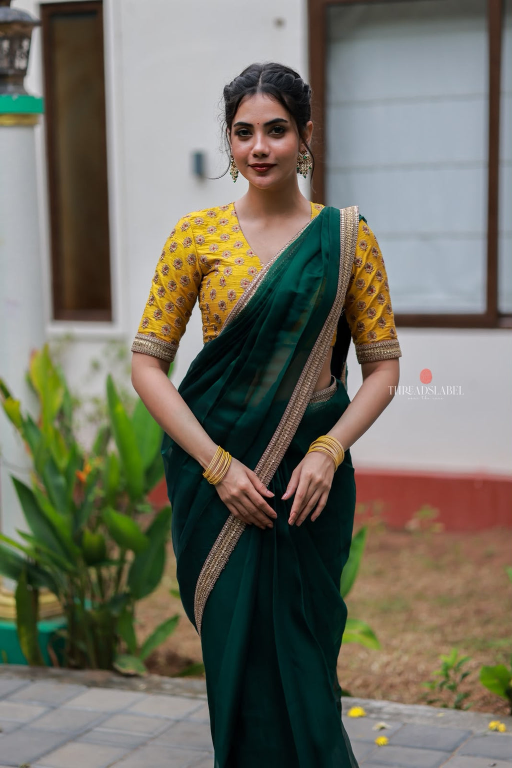 Green organza saree with yellow hand work blouse