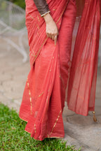 Orange rust saree with tissue handwork blouse