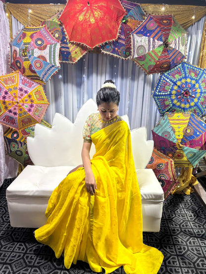 Yellow soft jute saree with green hand worked blouse