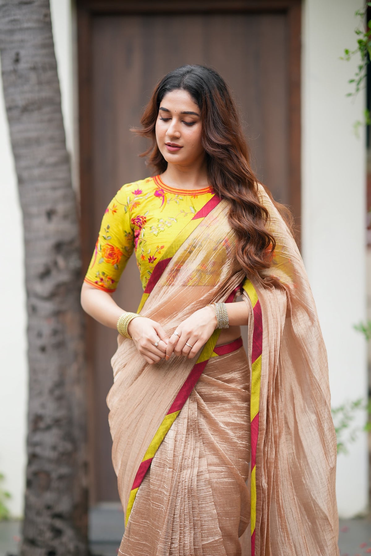 Antique gold tissue saree with parrot handwork blouse