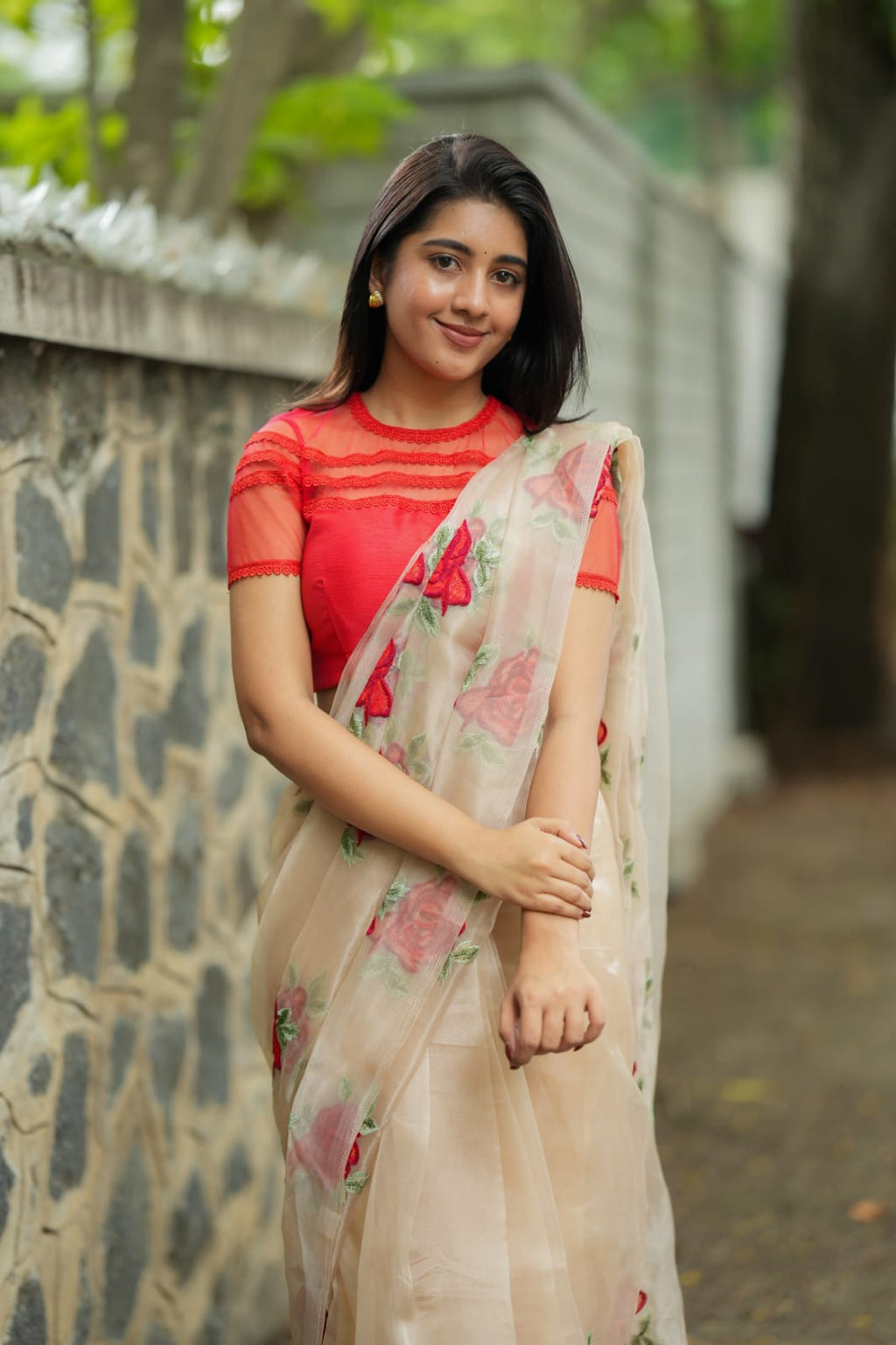 Glossy organza saree with red embroidery blouse