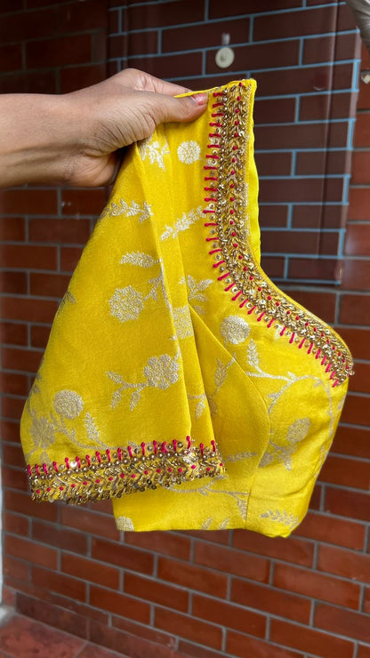 Pink stripped tissue saree with yellow floral hand work blouse