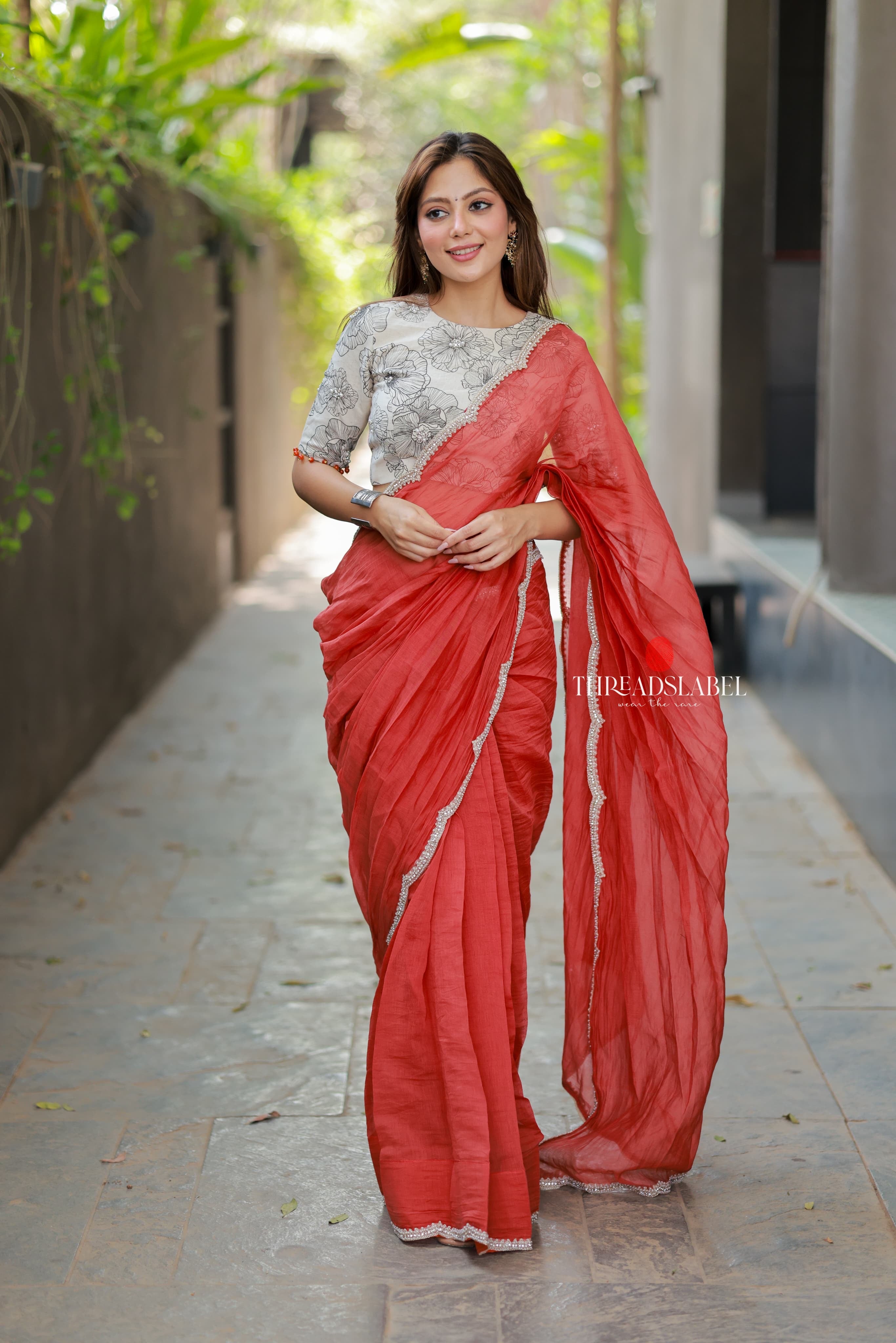Orange rust saree with pearl work blouse