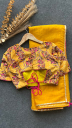 Yellow checked organza saree with velvet embroidery blouse