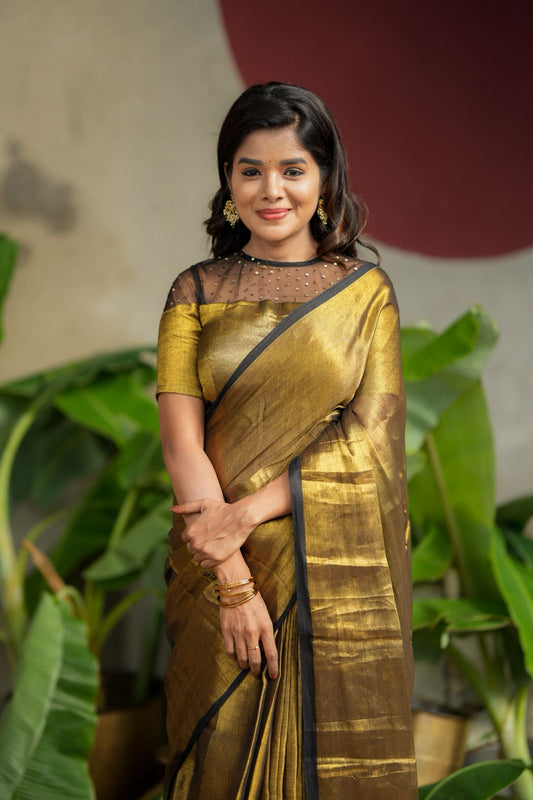 Golden soft tissue saree with hand work blouse