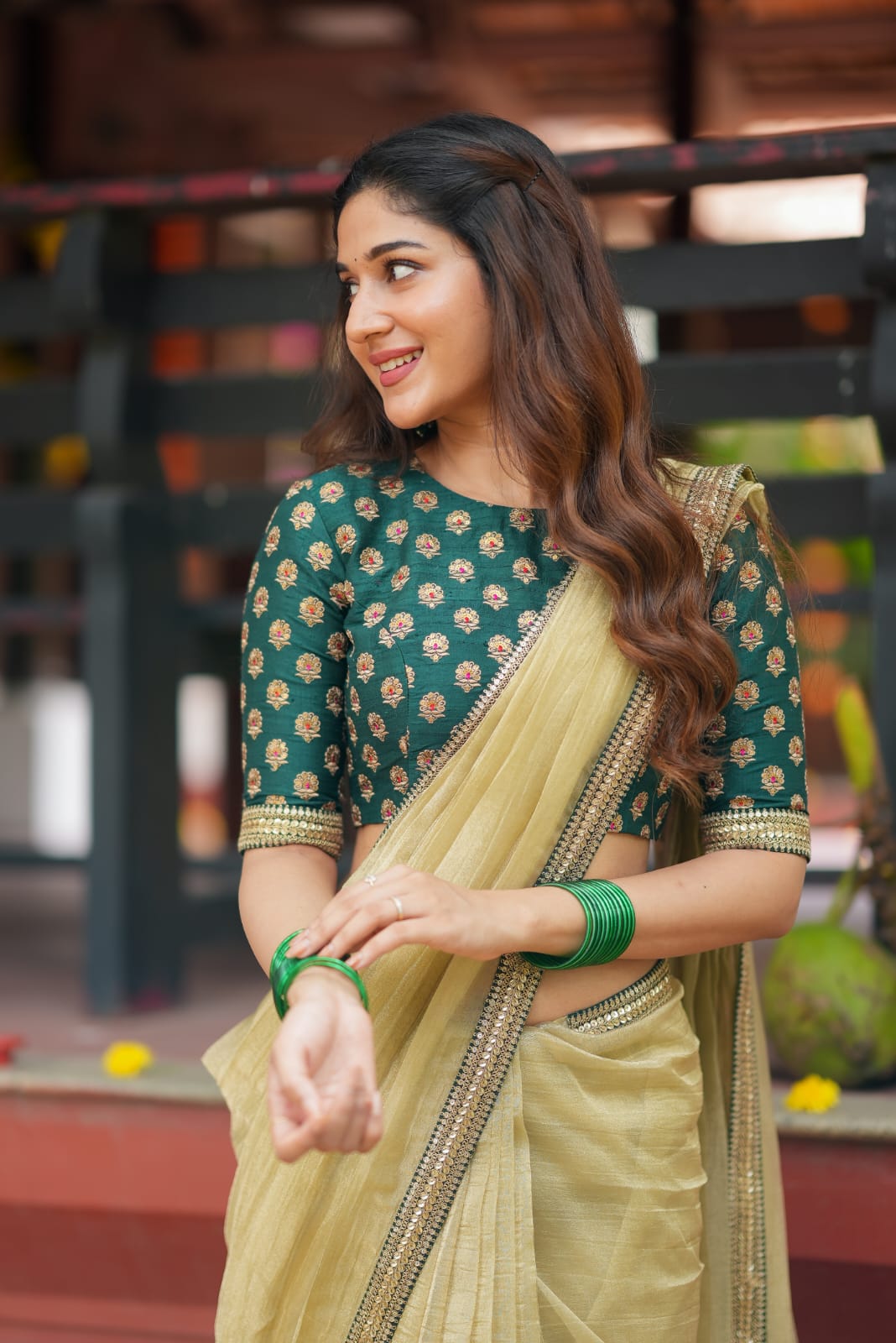 Gold tissue saree with green hand work blouse