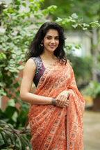 Pastel peach chiffon saree with brown hand work blouse