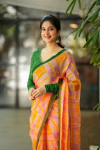 Orange viscose jute saree with green hakoba blouse