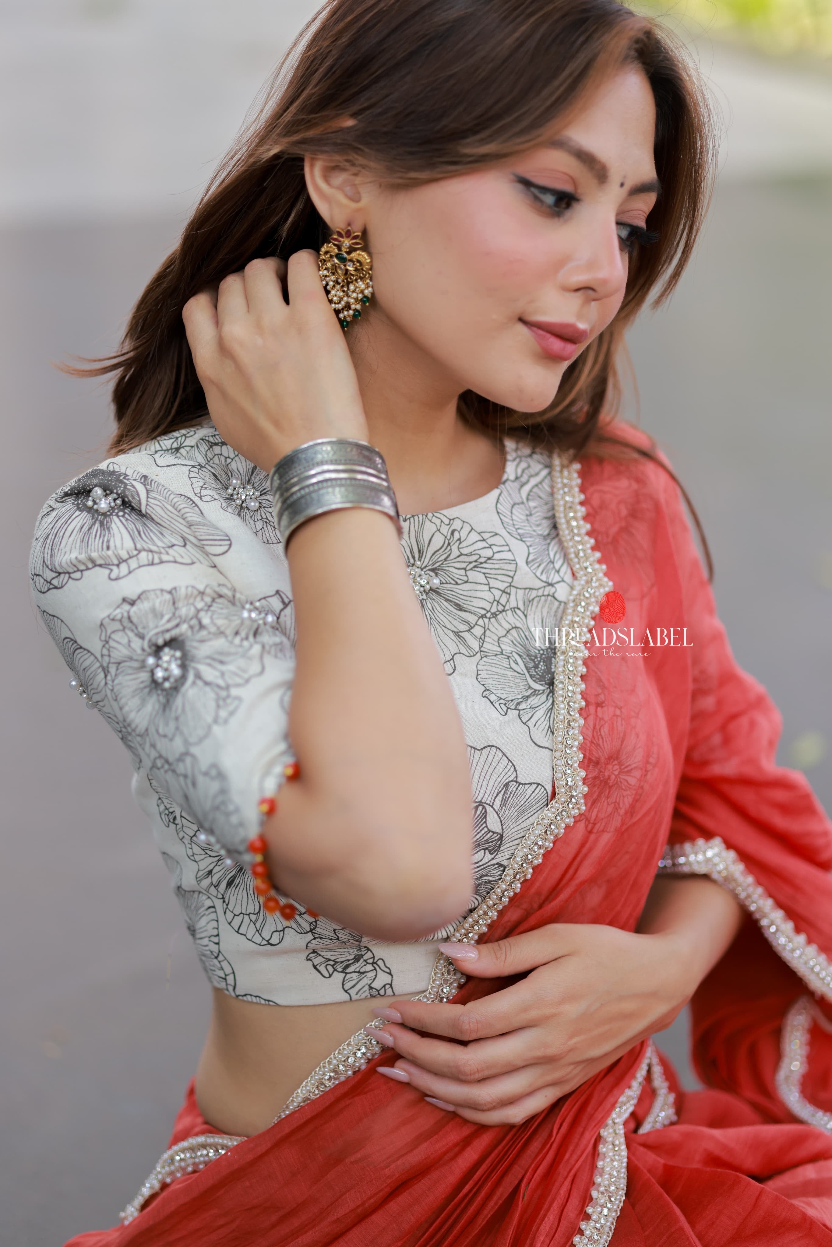 Orange rust saree with pearl work blouse