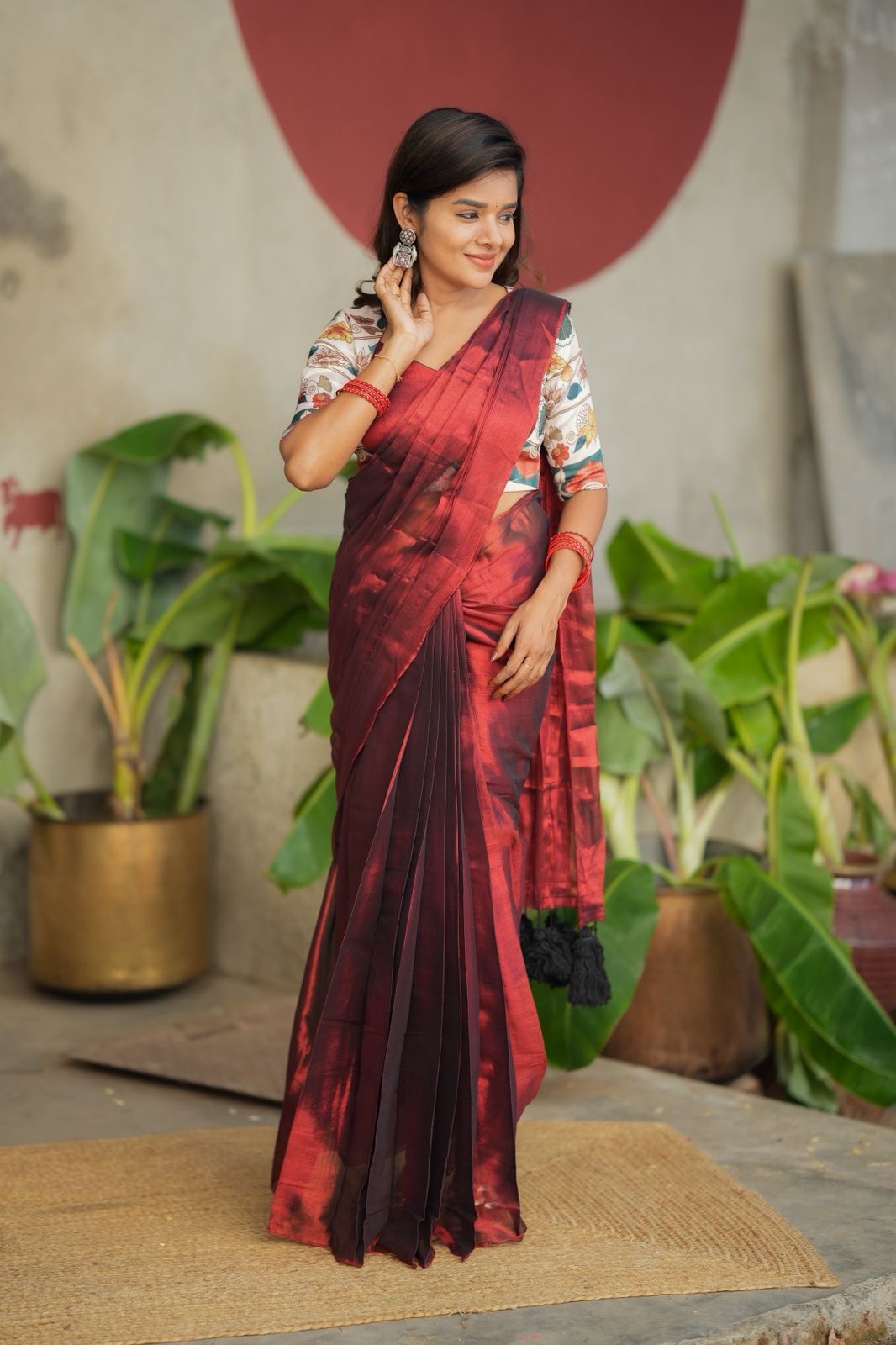 Wine soft tissue saree with floral blouse