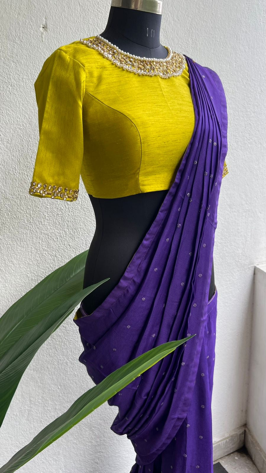 Purple soft jute saree with yellow JEWEL neck hand work blouse