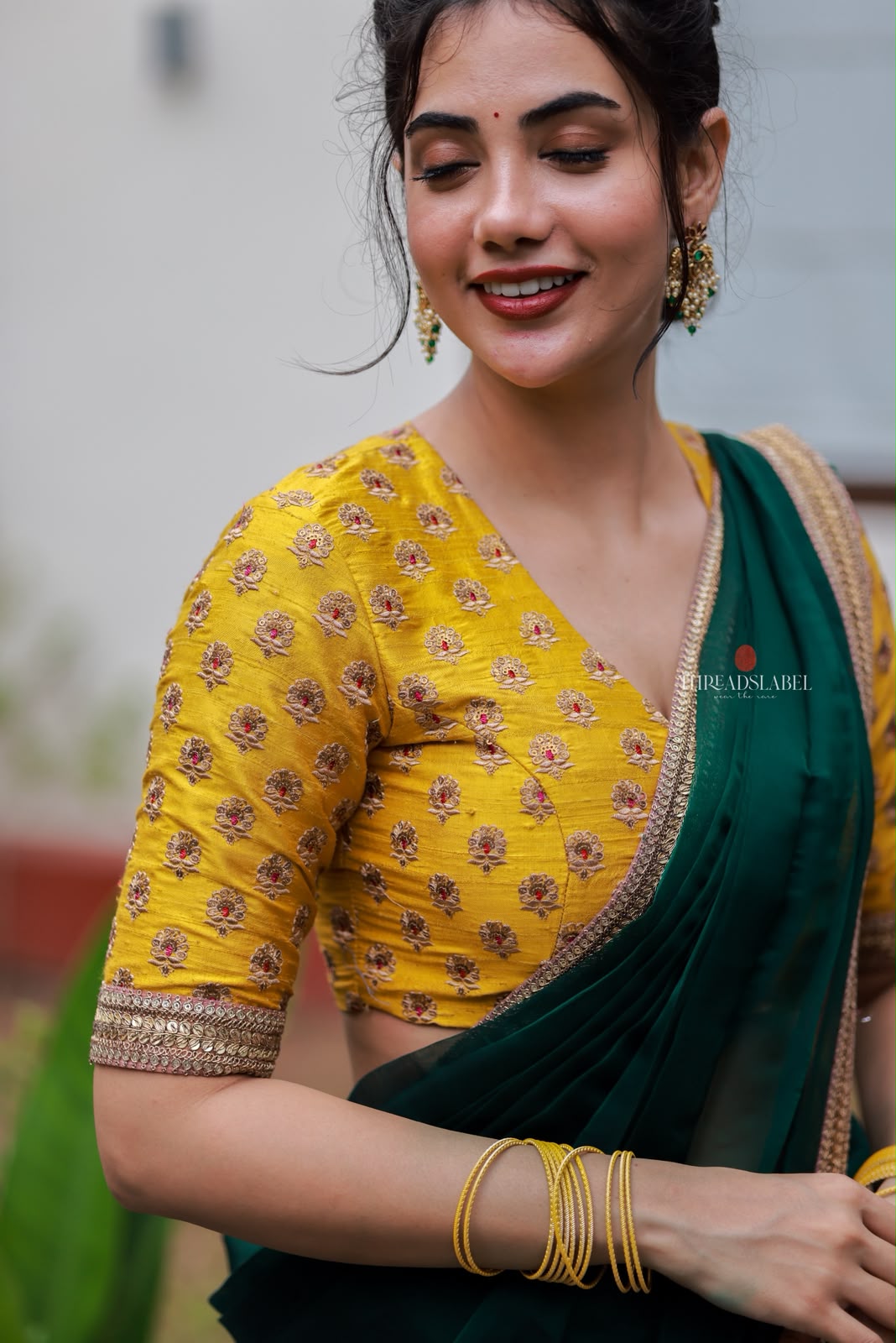 Green organza saree with yellow hand work blouse