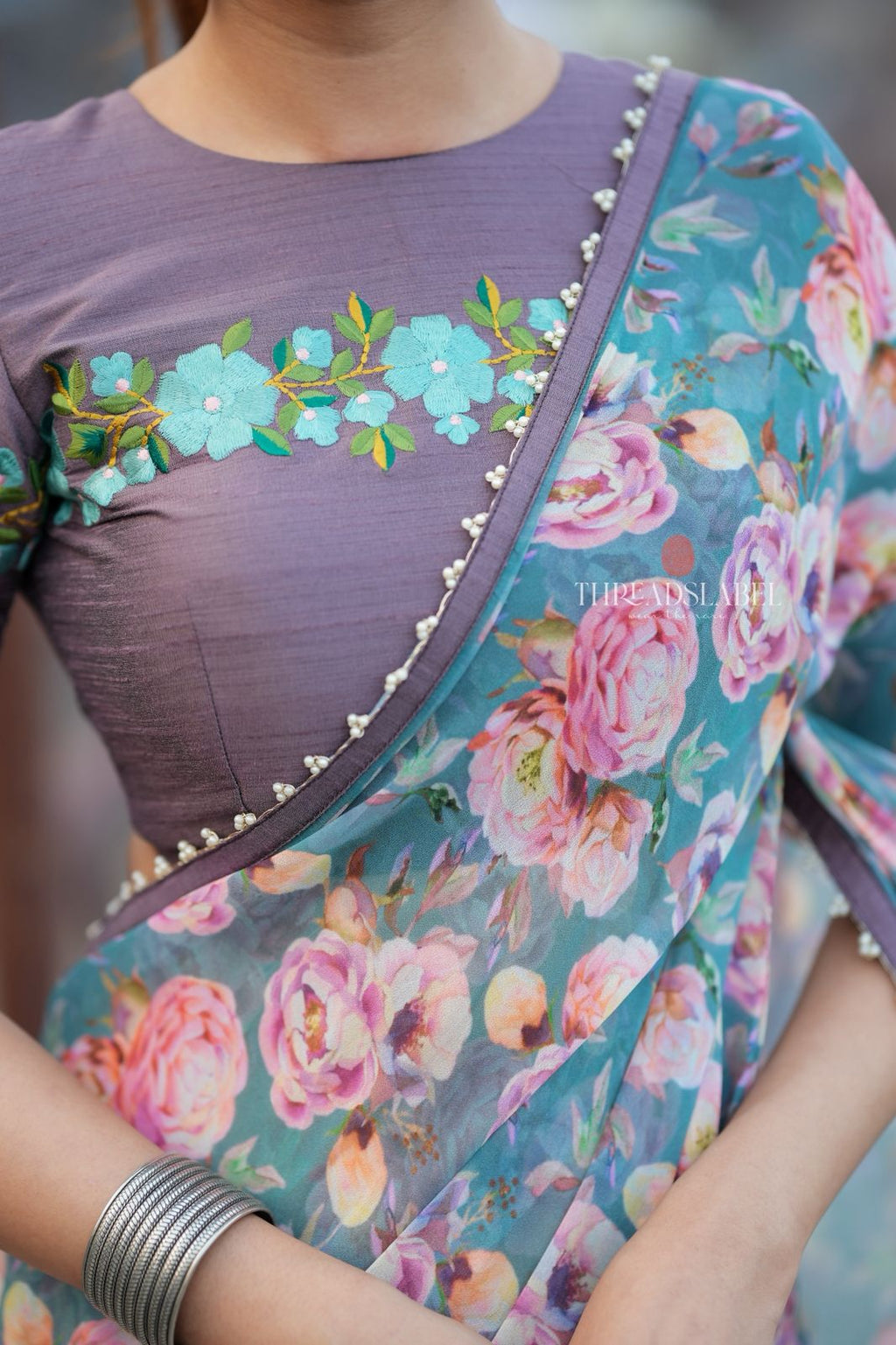 Blue floral georgette saree with grey embroidery blouse