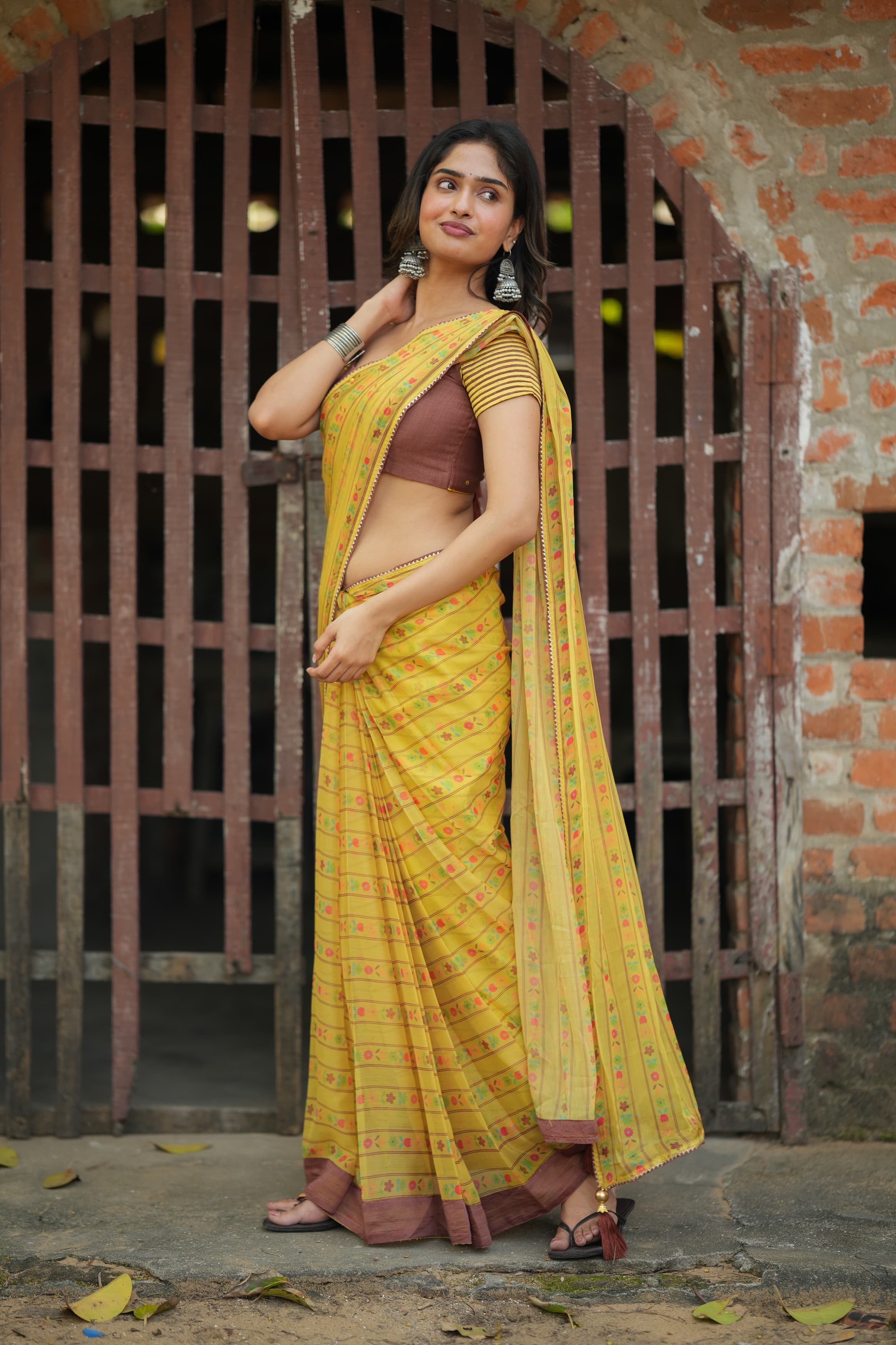 Yellow chiffon floral saree with hand work blouse