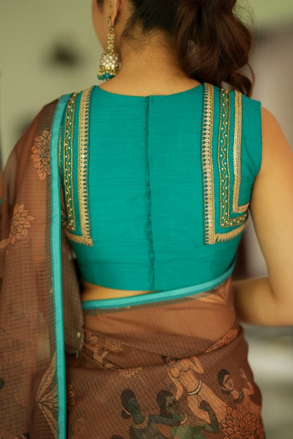 Brown kalamkari kota saree with blue hand work blouse