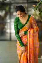 Orange viscose jute saree with green hakoba blouse