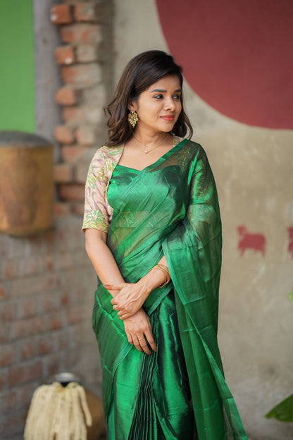 Green soft tissue saree with embroidered blouse