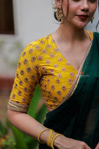 Green organza saree with yellow hand work blouse