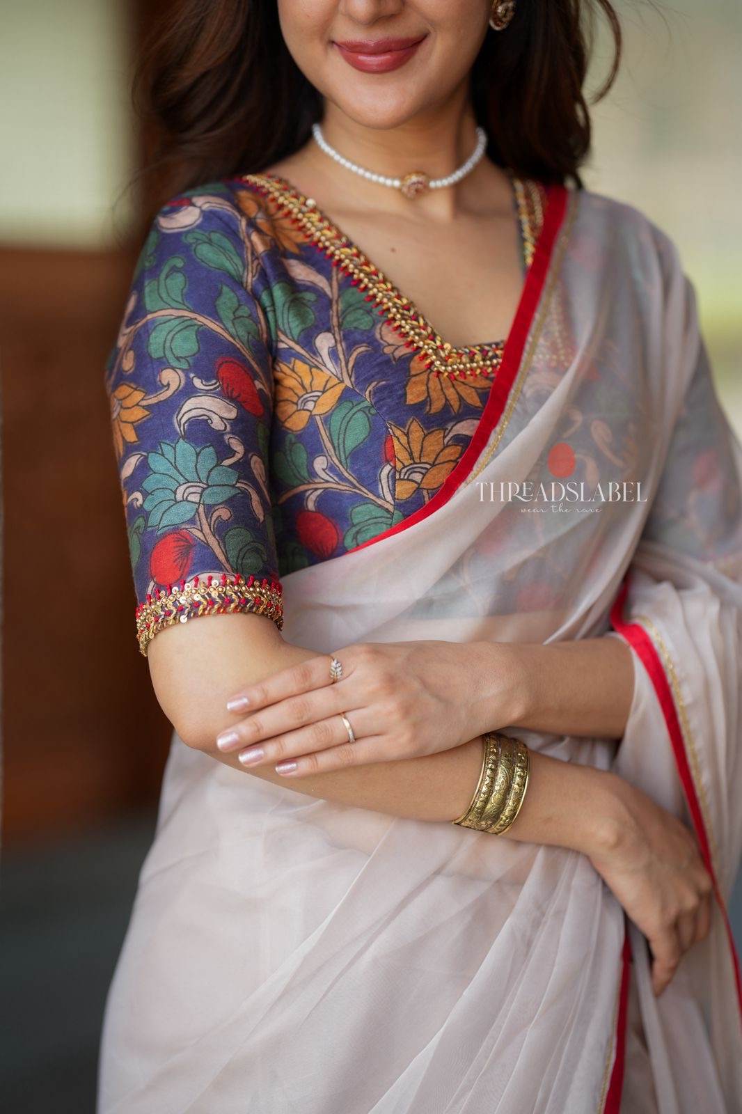 Light beige organza saree with hand work blouse