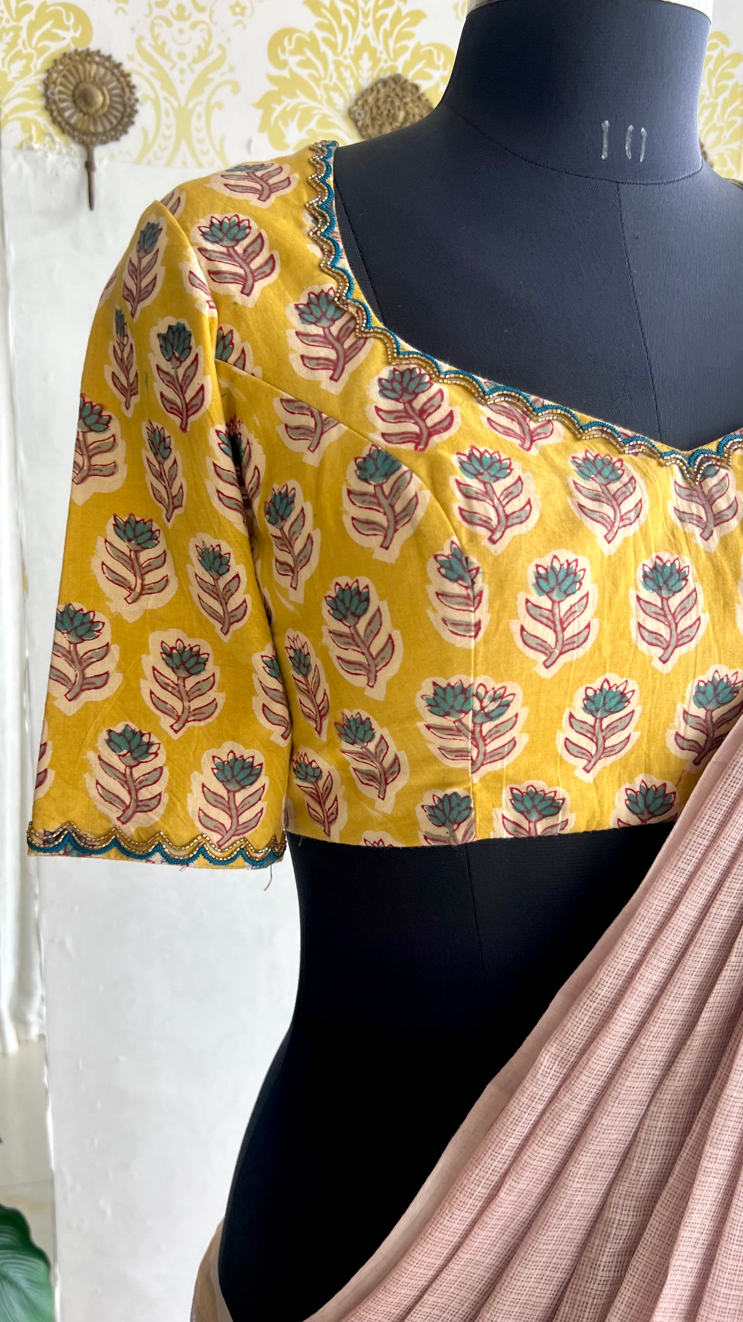 Light peach mul kota saree with yellow hand work blouse