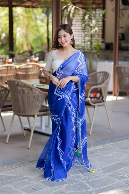 Blue chiffon saree with white embroidery blouse