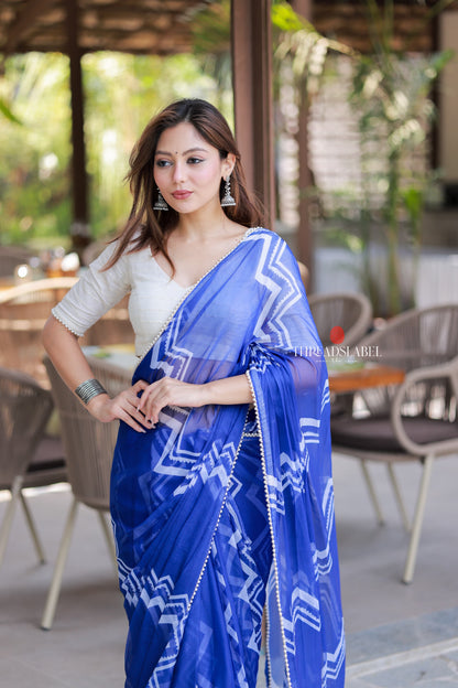 Blue chiffon saree with white embroidery blouse