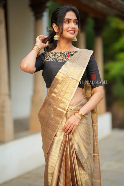 Golden tissue saree with black hand work blouse