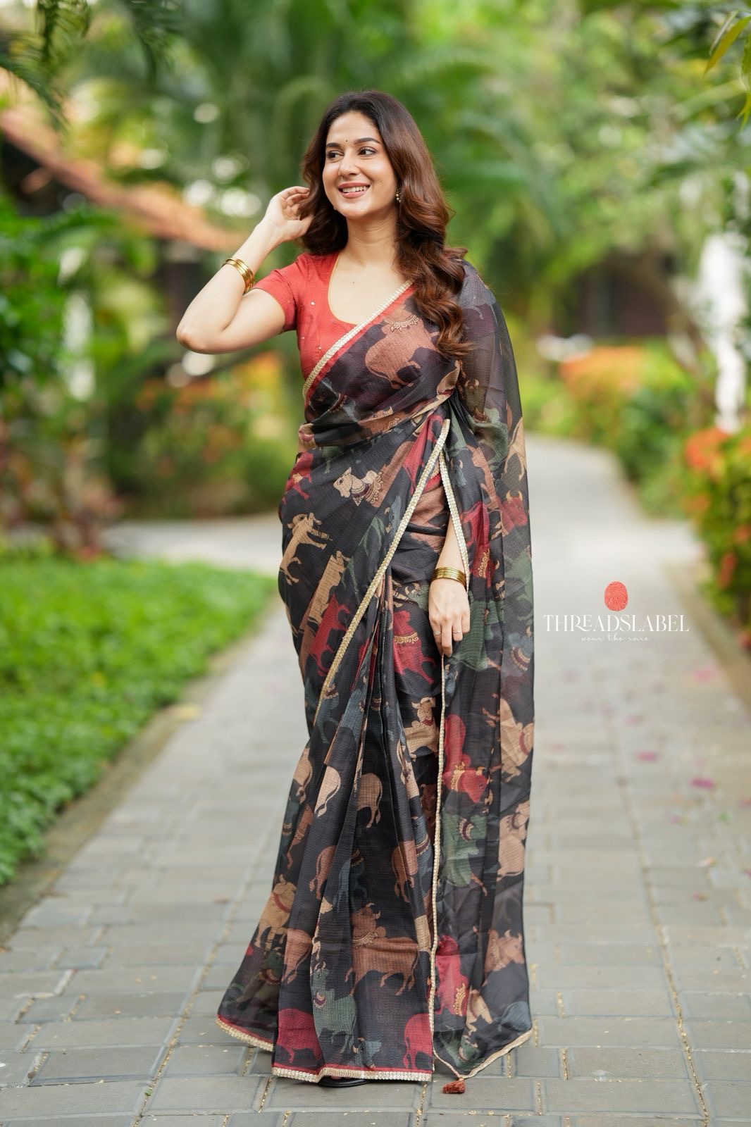 Black cow kota saree with paisley hand work blouse