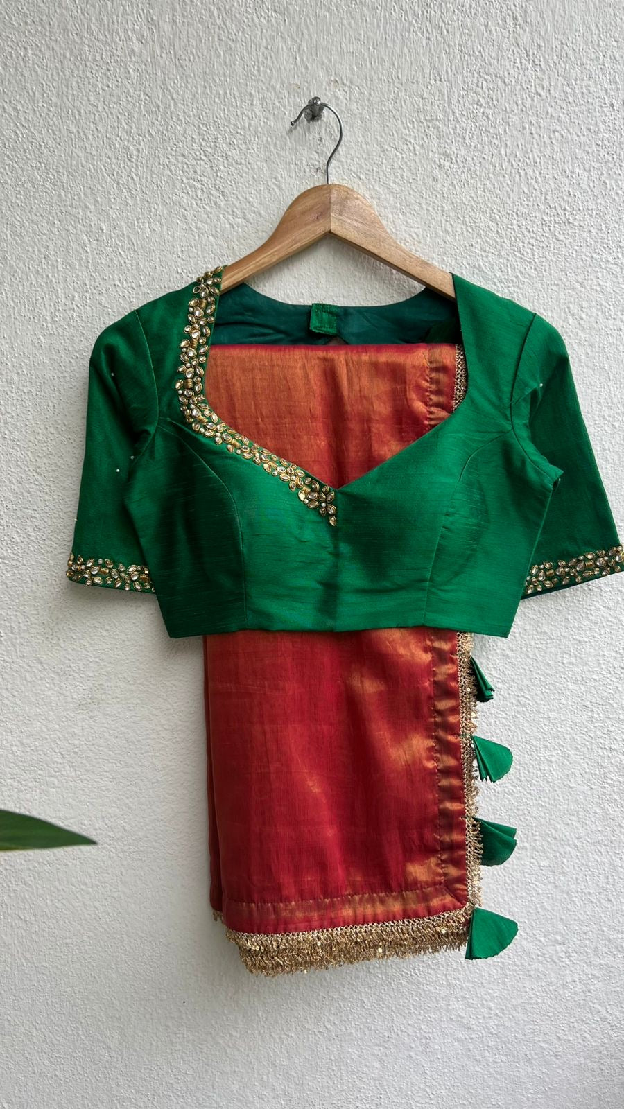 Red tissue saree with green hand work blouse