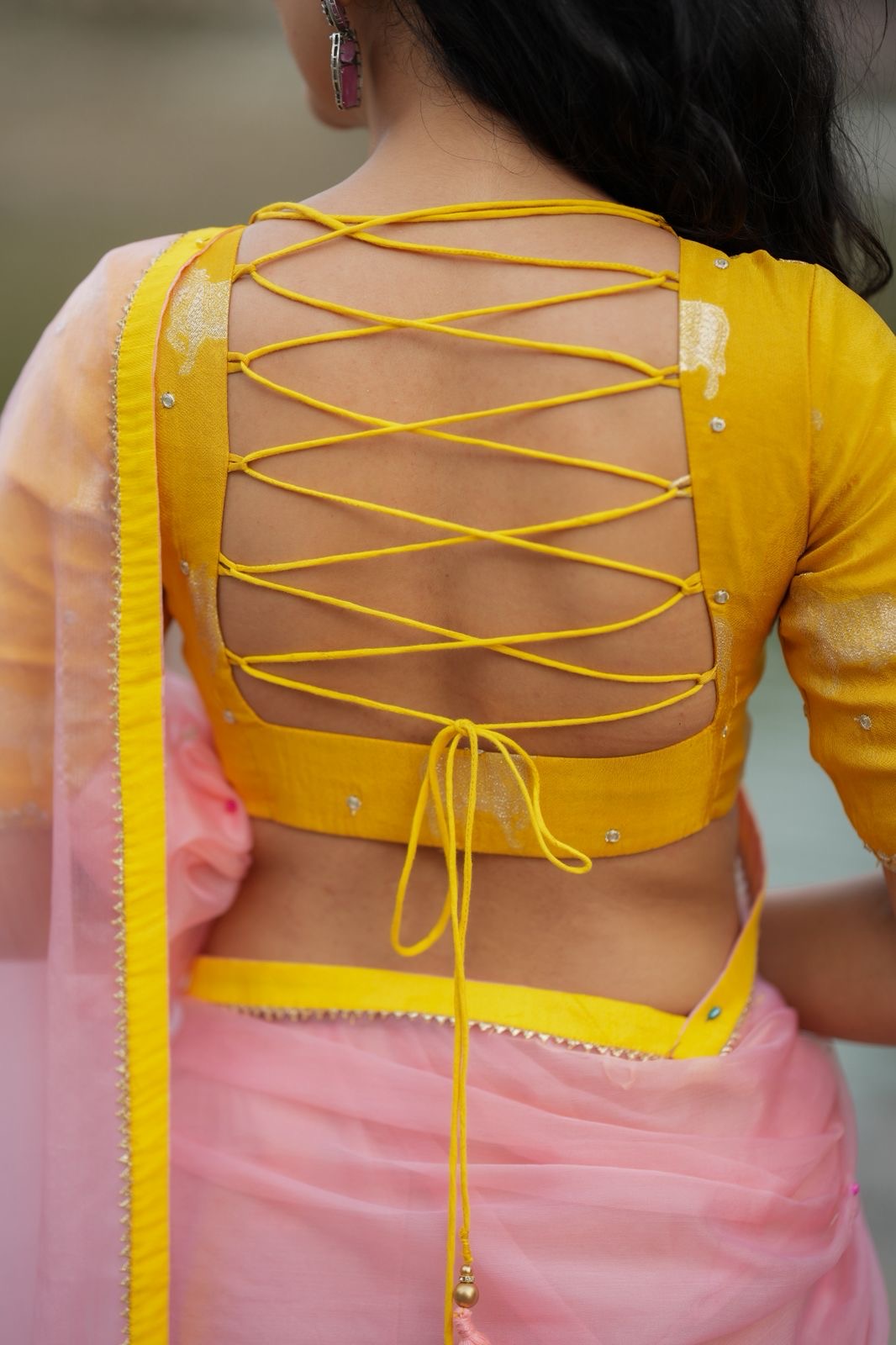 Peach organza saree with yellow hand work blouse
