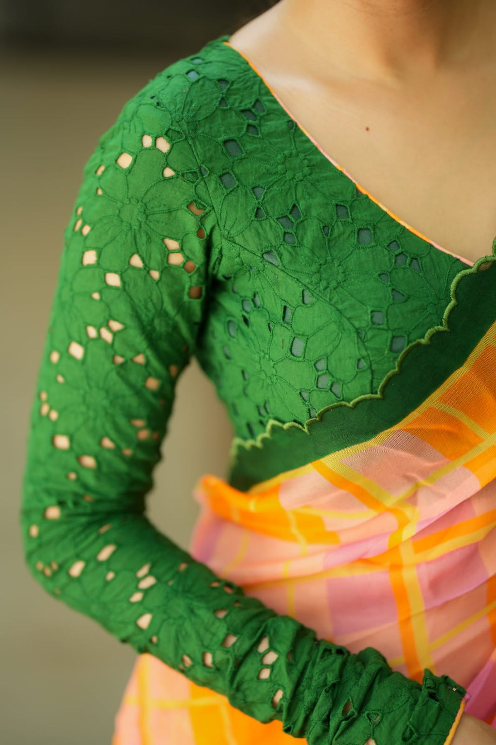 Orange viscose jute saree with green hakoba blouse
