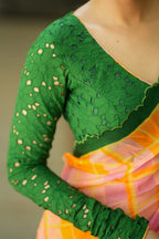 Orange viscose jute saree with green hakoba blouse