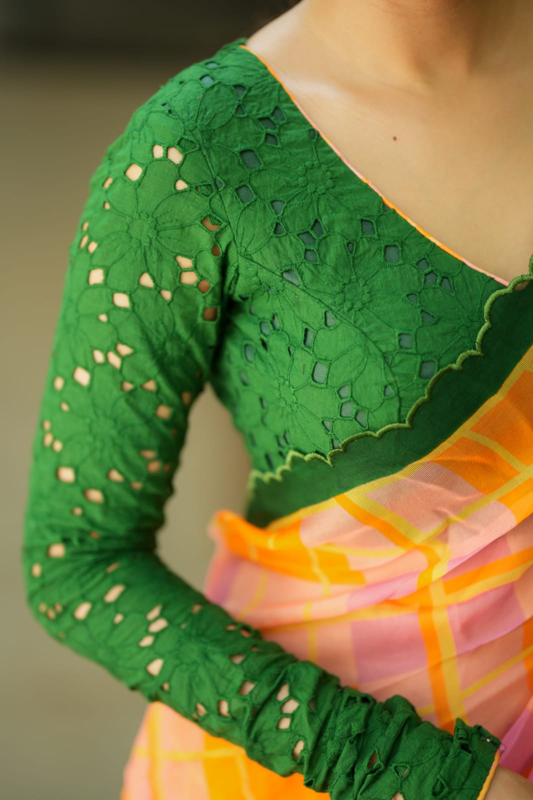 Orange viscose jute saree with green hakoba blouse