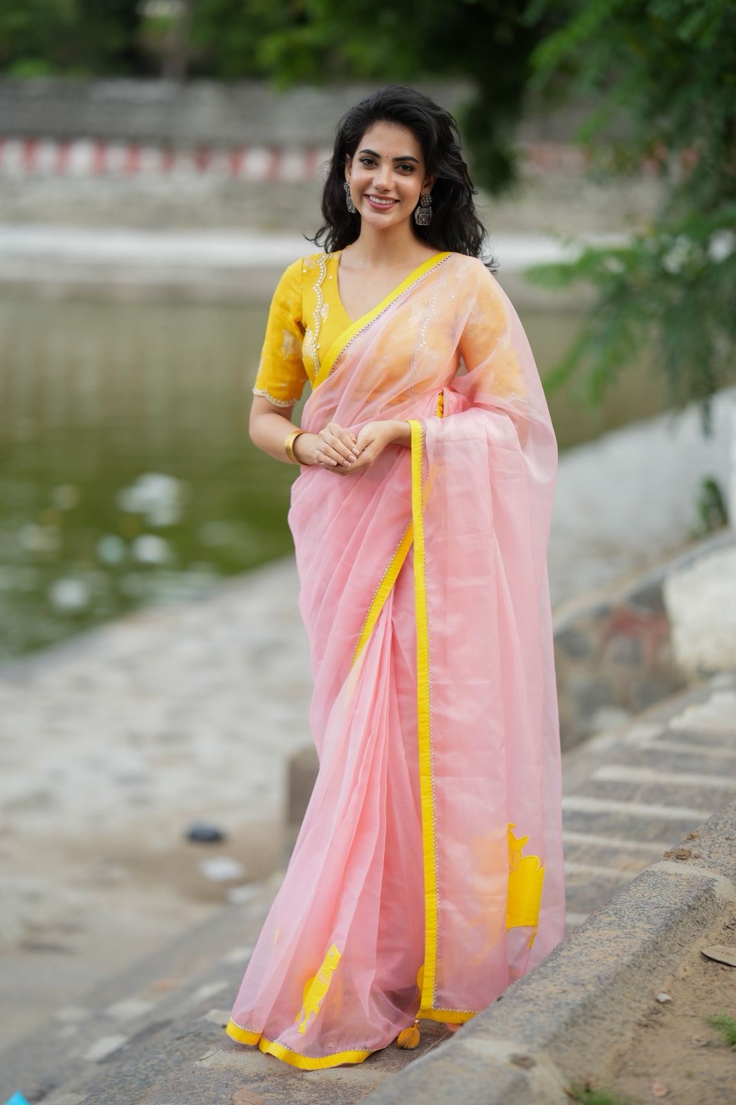Peach organza saree with yellow hand work blouse