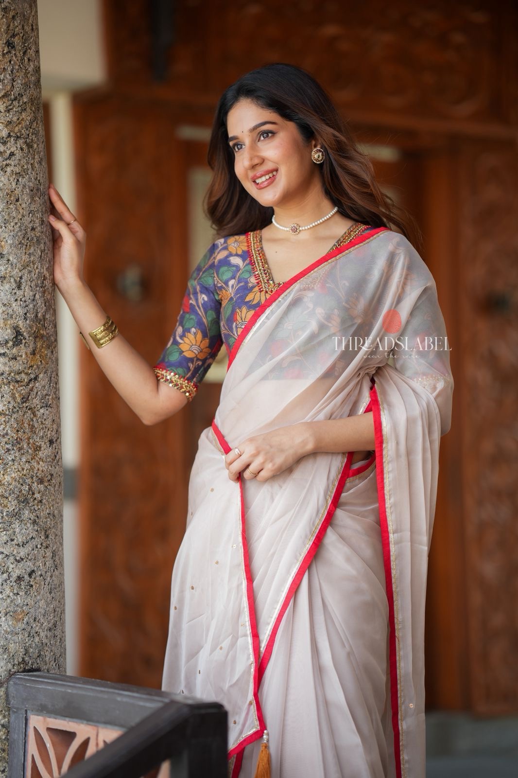 Light beige organza saree with hand work blouse