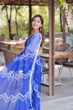 Blue chiffon saree with white embroidery blouse