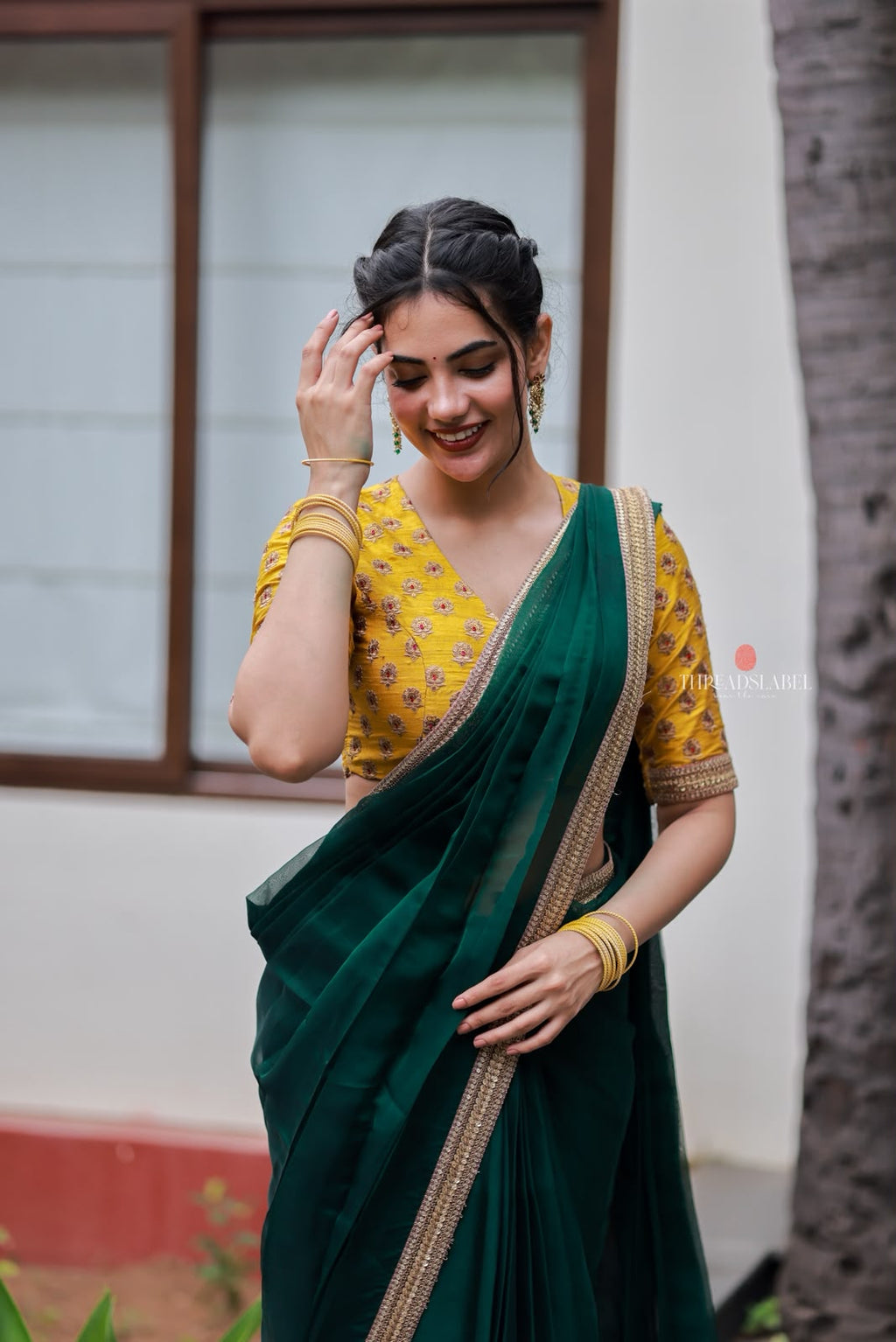 Green organza saree with yellow hand work blouse