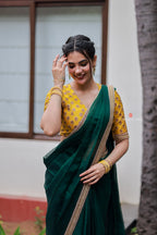 Green organza saree with yellow hand work blouse