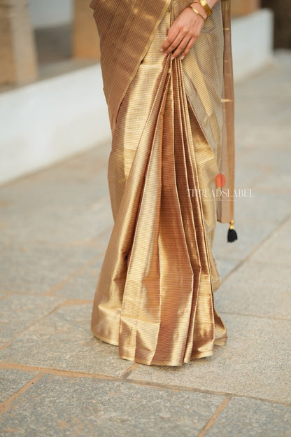 Golden tissue saree with black hand work blouse