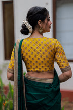 Green organza saree with yellow hand work blouse