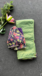 Green stripped tissue saree with purple floral hand work blouse