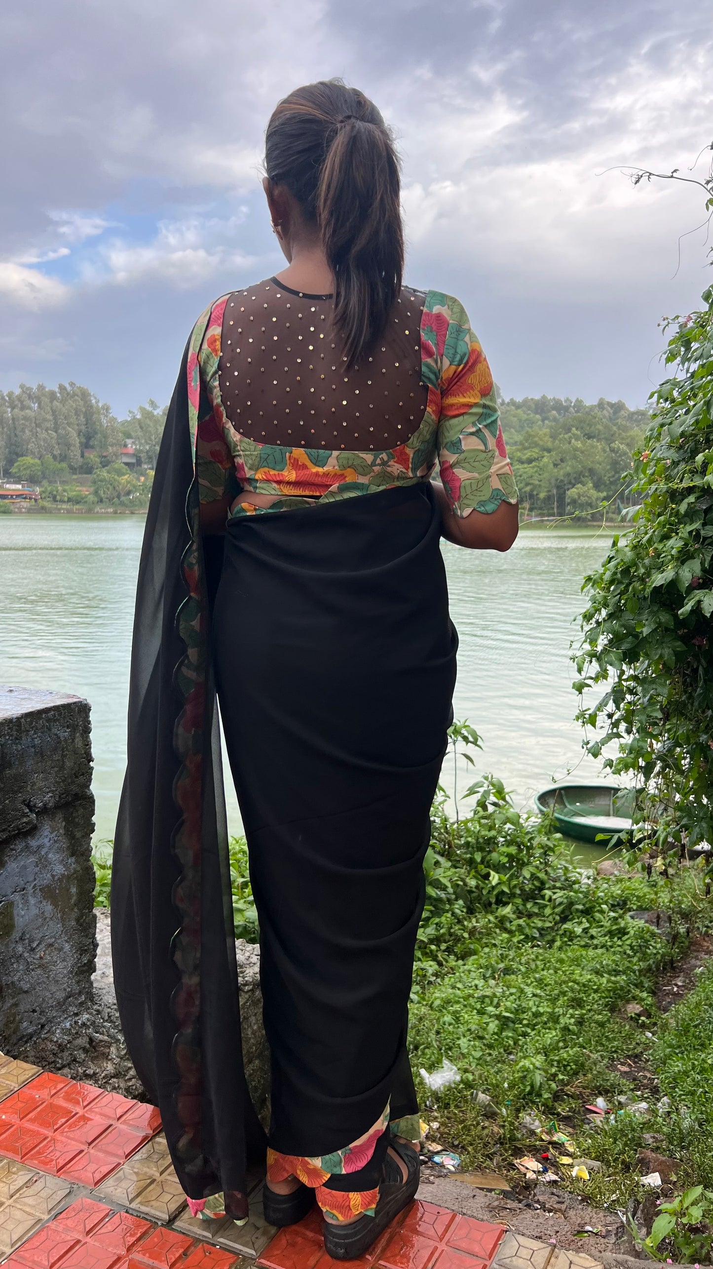 Black georgette saree with floral cotton blouse