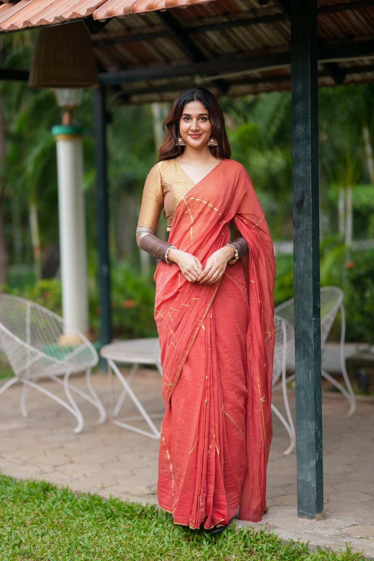 Orange rust saree with tissue handwork blouse
